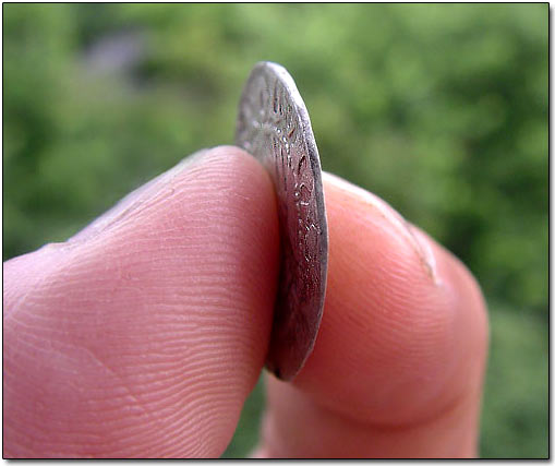 The Coin's Thinness