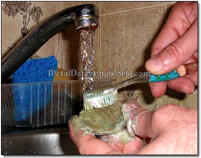 Brushing Coins with Toothpaste