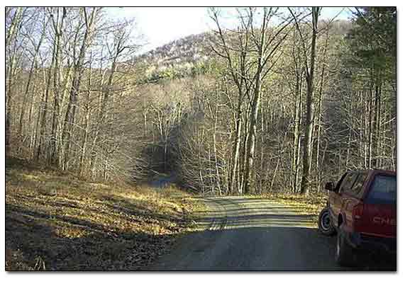 Dirt Road Leads Up To The Mountains