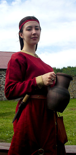 A Medieval Girl Holding a Jug