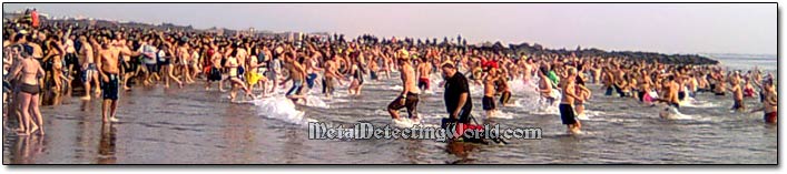 Beach Crowded with Swimmers