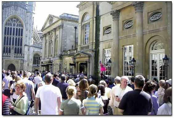 Crowd Gathered Around A Street Performer