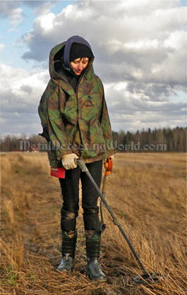 XP Deus User Metal Detecting in Field