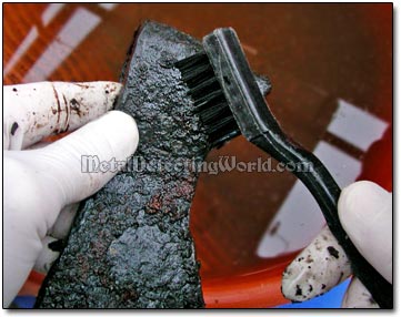 Brushing Black Carbonate Coating Off