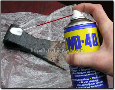 Spraying WD-40 onto Derusted Half to Prevent Rerusting