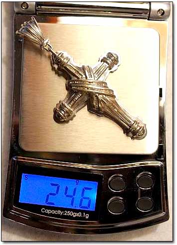 Gold Crucifix on Weight Scale
